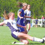 SLIDING TO THE RAIDERSâ€™ DEFENSE â€” Fryeburg Academyâ€™s Abby Smith (#6) knocks the ball away from a charging Jacqui Black of Lake Region during last weekâ€™s meeting between the two rivals. The game ended in a scoreless tie. (Rivet Photo)