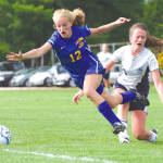 TRIPPED UP â€” Lake Regionâ€™s Hannah Perkins (left) hits the turf after taking a bump from Fryeburg Academyâ€™s Abby Smith during last weekâ€™s varsity soccer game at the Academy. Neither team could mount many scoring opportunities, and despite two overtime sessions, the Lakers and Raiders settled for a tie. (Rivet Photo)