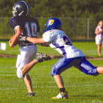 LESSON ON NEVER GIVING UP ON A PLAY â€” Fryeburg Academy quarterback Andrew Rascoe (#10) appeared to have a touchdown during the annual Pleasant Mountain Bowl, but he was hauled down from behind by Lake Regionâ€™s Kyle Stevens, who didnâ€™t give up on the play. Although Fryeburg Academy recovered the loose ball, Stevensâ€™ hustle and saving tackle proved to be a big one as the Laker defense held to keep the game close during last Fridayâ€™s season opener in Fryeburg. (Rivet Photos)