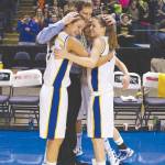 HAPPY MOMENT shared by LR Coach Paul True with Abby Craffey (left), Sydney Hancock (right) and Rachel Wandishin (back). (Photo by Greg Van Vliet)